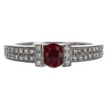 Pretty modern 18ct white gold ruby and diamond ring, the oval ruby 0.30ct approx within pavé diamond