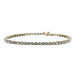 Classic 18ct yellow gold diamond tennis  line bracelet, set with fifty-seven round brilliant-cuts,
