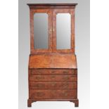 Fine George II feather banded walnut bureau cabinet, the moulded cornice over a pair of glazed