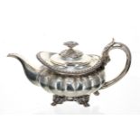 George IV silver melon shaped teapot, the hinged cover with cast foliate finial with a leaf cast