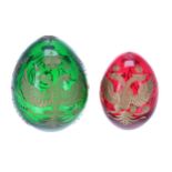 Two similar Russian St Petersburg hand worked glass eggs, the largest green example on stand 4.5" (