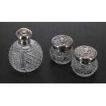 Attractive silver mounted miniature glass globe scent bottle, the screw cover enclosing an inner