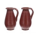 Pair of terracotta pottery jugs, with an artists monogram AT to the undersides, 8.5" high (2)