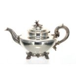 William IV silver teapot, the hinged cover with a cast flower finial, over a plain body raised on