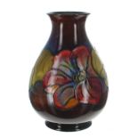Moorcroft Pottery 'Clematis' vase, with factory stamps and sticker to the underside, 8.25" high