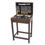 Oak cased part canteen of silver plated cutlery, on stand