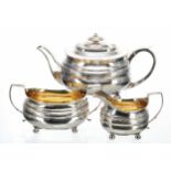 George III silver three piece tea set, each piece decorated with a foliate engraved band and