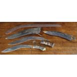 Two Kukri knives, longest 15" blade; also a boomerang 28" long