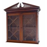 Georgian style mahogany wall cabinet, the broken arch pediment over two astragal glazed doors