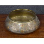 Cairo Ware brass, copper and silvered bowl, decorated with stylised floral panels with text on a