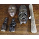 Two African hardwood carved masks, largest 13" high; together with two Southern Indian carved