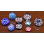 Nine millefiori glass paperweights; including two by and labelled Strathearn (9)