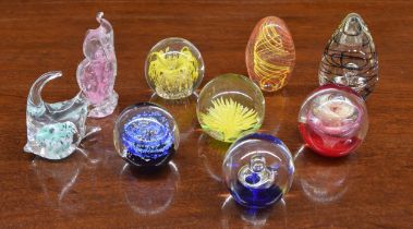 Nine assorted decorative glass paperweights; including a fish by Chris Dodds (9)