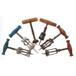Three split frame corkscrews with wooden handles; together with three further corkscrews (6)