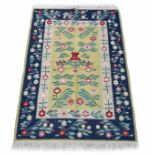 Decorative floral Kilim type rug, decorated with pink flowers and foliage within floral and foliat