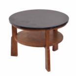 Gordon Russell walnut circular low coffee / book table, the plain top over a circular undertier,