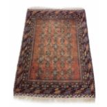 Persian Lori type rug, on a red ground decorated with multiple geometric medallion runs within