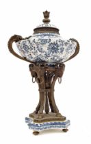 Decorative reproduction bronze mounted porcelain urn with cover, the body decorated with scrolling
