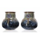 Pair of Royal Doulton Art Nouveau design stoneware vases, 288Y, with blue floral swag decoration