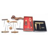 Group of assorted wooden handle direct pull corkscrews; together with a B&H pull and stopper set and