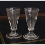 Pair of Georgian deceptive ale glasses, the conical deception bowls over short knopped stems, both