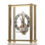 Jaeger LeCoultre small mystery desk clock timepiece, the 2.25" silvered chapter ring enclosing a