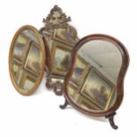 Rococo style carved wooden wall mirror, the scroll frame parcel gilt decorated, 23" high; together