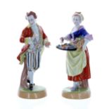 Pair of Dresden Potschappel porcelain figures, of a flower seller and a gentleman taking snuff,