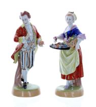 Pair of Dresden Potschappel porcelain figures, of a flower seller and a gentleman taking snuff,