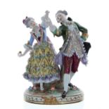 Sitzendorf porcelain figural group of a dancing couple, the lady holding a fan, a tree trunk behind,