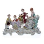 Large Sitzendorf porcelain figural group interior scene, with a lady seated playing a zither, a