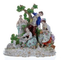 Sitzendorf porcelain figural group, modelled with a gentleman in a blue coat standing by a tree, a