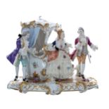 Unterweissbach porcelain figural group of a lady emerging from a sedan chair, with two courtiers