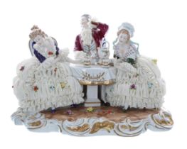 Unterweissbach porcelain figural group interior scene, two ladies and a gentleman seated at a