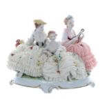 Unterweissbach porcelain figural group of three ladies in simulated net dresses encrusted with