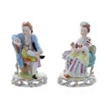 Pair of Dresden Potschappel porcelain figures, of a gentleman in a pale blue coat seated while