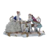 Unterweissbach porcelain figural group interior scene, 'The Chess Players', modelled as a lady and