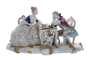Unterweissbach porcelain figural group interior scene, 'The Chess Players', modelled as a lady and
