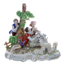Sitzendorf porcelain figural group, with a gentleman in a blue coat standing by a tree with a bird
