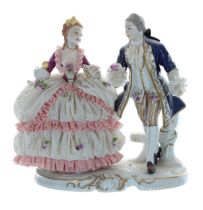 Unterweissbach porcelain figural group of a lady wearing a simulated net crinoline dress with a