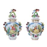 Pair of Dresden Potschappel porcelain jars with covers, each cover with a bird perched on the