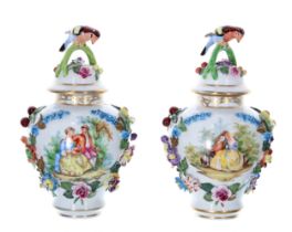Pair of Dresden Potschappel porcelain jars with covers, each cover with a bird perched on the