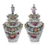 Good pair of Dresden porcelain vases with covers, the covers with figural finials of a gentleman