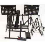 Selection of various music stands to include a Stagg folding guitar stool, an Editors Keys