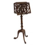 Good Victorian mahogany adjustable duet music stand, the ledges pierced with scrolling foliage