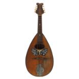 Old Neapolitan mandolin labelled Pietro Ruffini, with butterfly mother of pearl inlaid scratchplate,