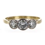 Good 18ct yellow gold three stone diamond ring, round brilliant-cuts in a rub-over setting,