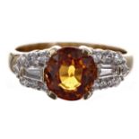 18ct yellow gold ring set with round natural fancy orange sapphire and diamonds, the sapphire 2.40ct
