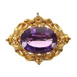 Attractive 19th century large oval amethyst brooch in a gold repousse mount, 19.2gm, 41mm x 54mm