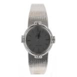 Omega De Ville 18ct white gold oval lady's wristwatch, striped silvered oval dial with applied baton